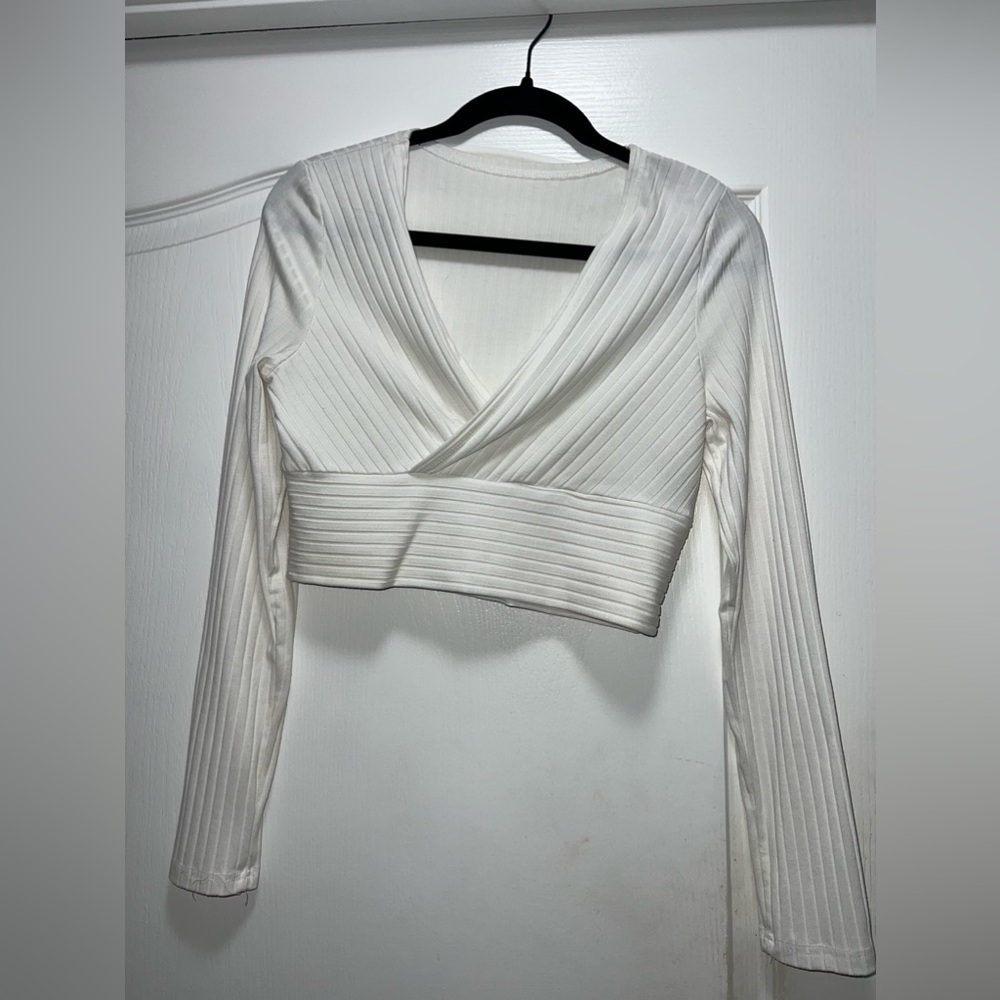 White long-sleeve crop top.